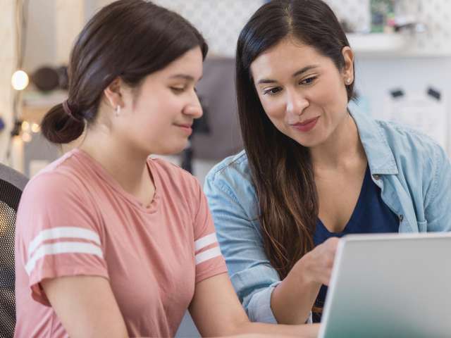 Mother and teenage daughter online